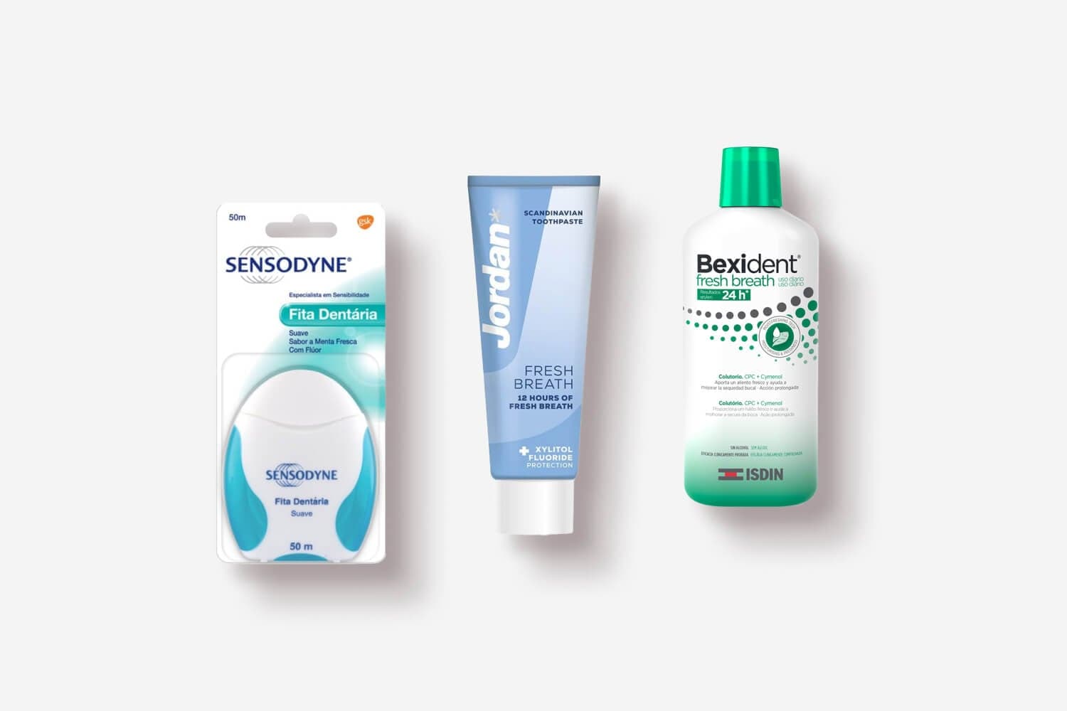 Sensodyne Fita Dentária 50m dental tape, Jordan Fresh Breath toothpaste and Isdin Bexident Fresh Breath mouthwash on grey.